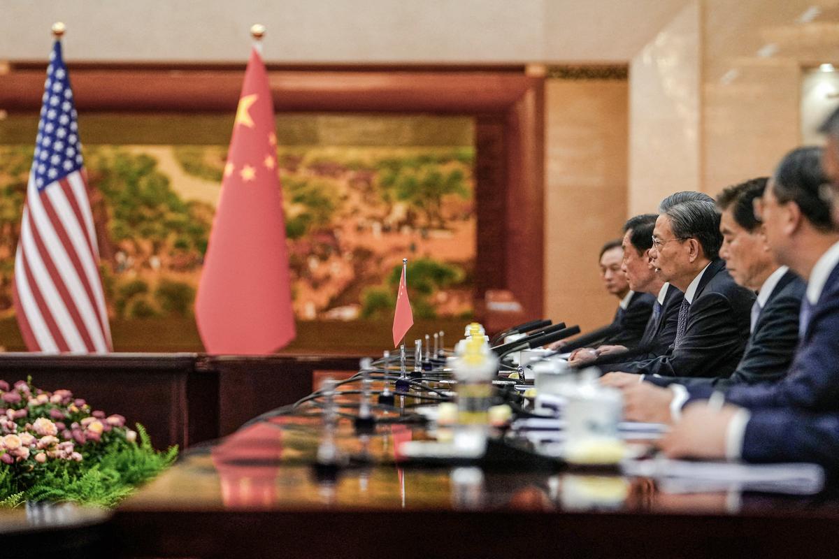 Zhao Leji (C), chairman of China's National People's Congress, speaks during a bilateral meeting with U.S. Senate Majority Leader Chuck Schumer (D-N.Y.) at the Great Hall of the People in Beijing on Oct. 9, 2023. (ANDY WONG/POOL/AFP via Getty Images)
