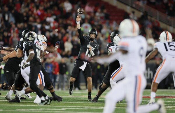 Jack Plummer (13) of the Louisville Cardinals against the Virginia Cavaliers at Cardinal Stadium in Louisville, Ky., on Nov. 9, 2023. (Andy Lyons/Getty Images)
