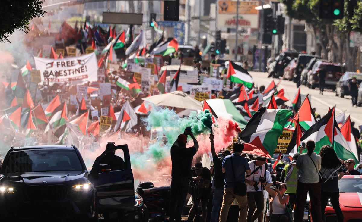 Thousands of demonstrators waving Palestinian flags and signs march in support of Palestinians in Los Angeles on Oct. 14, 2023. (David Swanson/AFP via Getty Images)