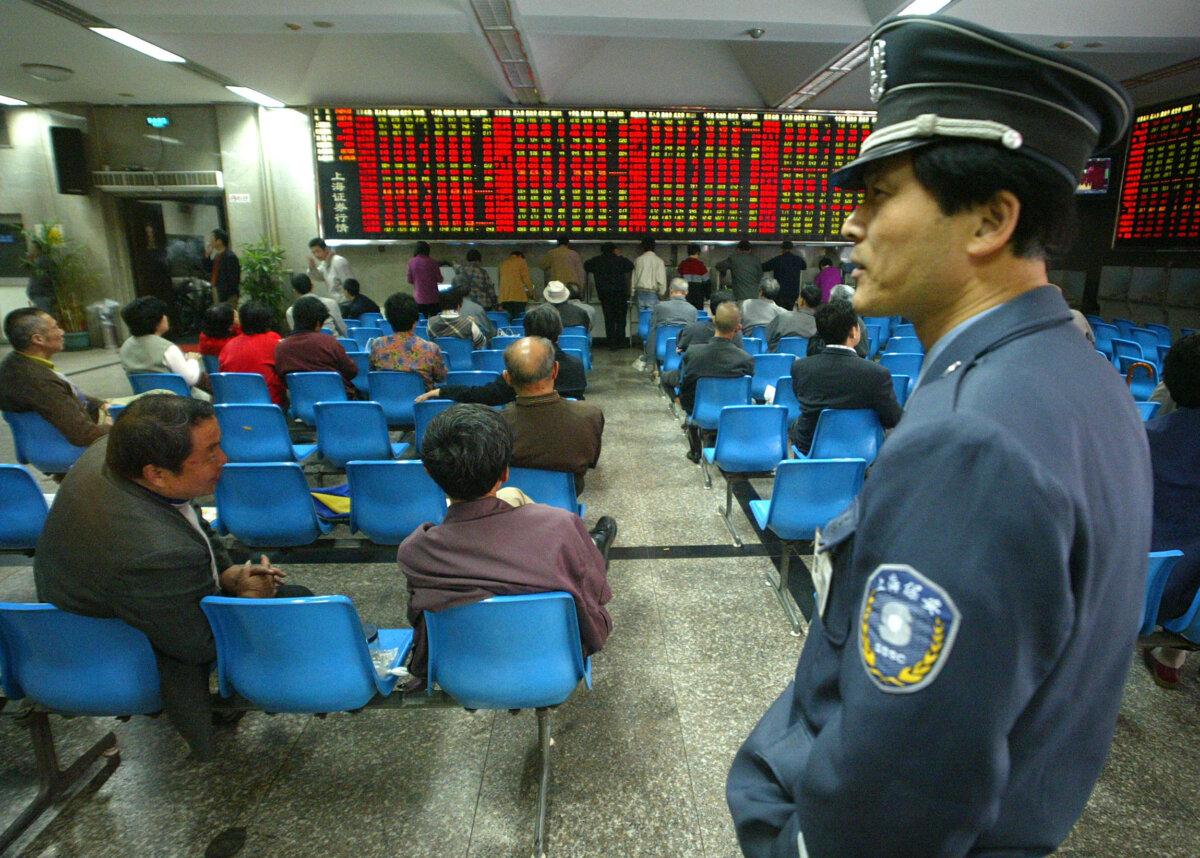 A security man stands in Shanghai, on April 30, 2004. (Liu Jin/AFP via Getty Images)