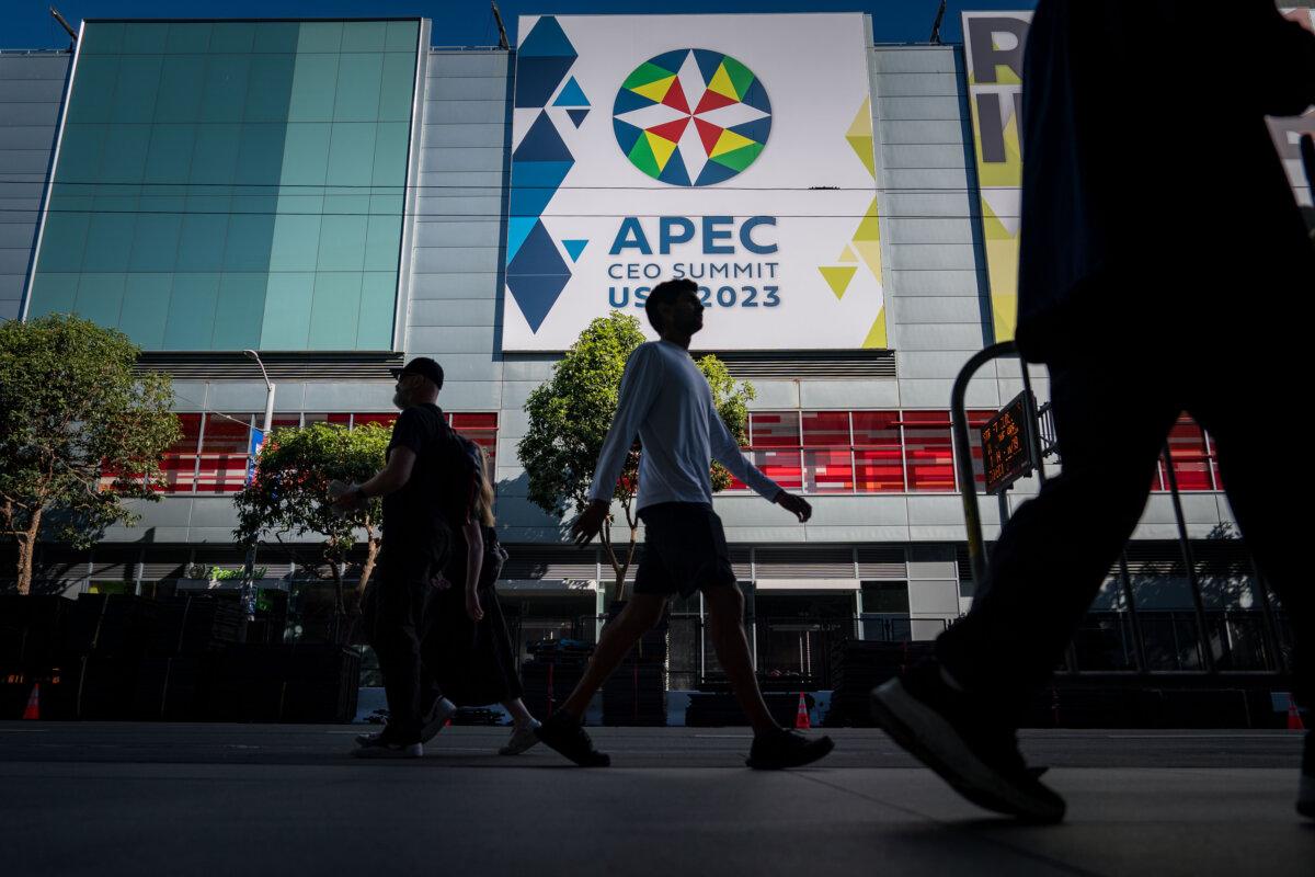 People walk outside the Moscone Center during the Asia-Pacific Economic Cooperation meetings in San Francisco on Nov. 11, 2023. (Kent Nishimura/Getty Images)