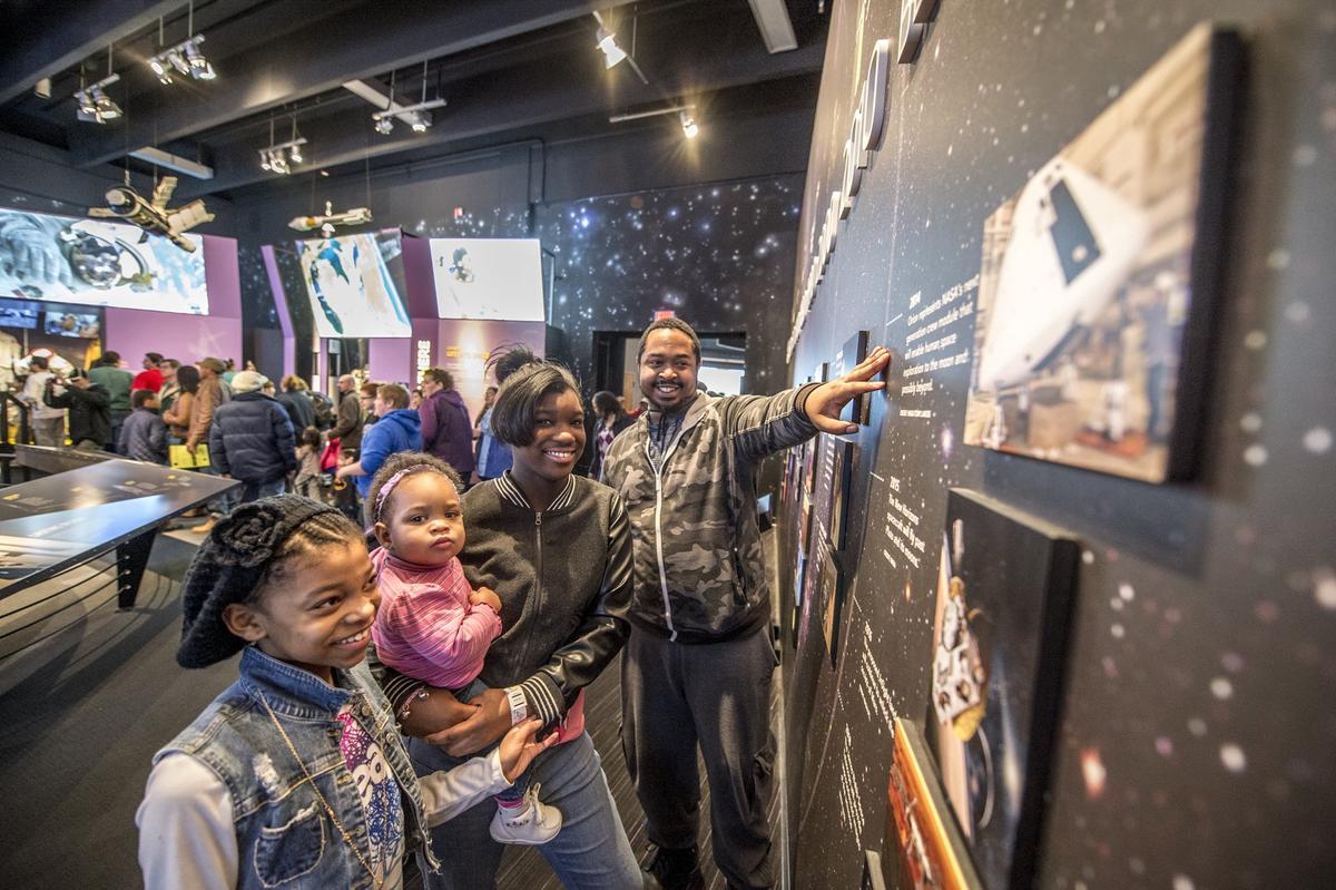 A family enjoys the exhibits at the Great Lakes Science Center. (Copyright Great Lakes Science Center)