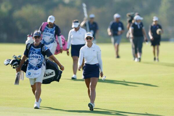 Emily Kristine Pedersen of Denmark walking on the 16th hole beside her caddie during the final round of The ANNIKA driven by Gainbridge at Pelican Golf Club in Belleair, Fla., on November 12, 2023. (Mike Ehrmann/Getty Images)