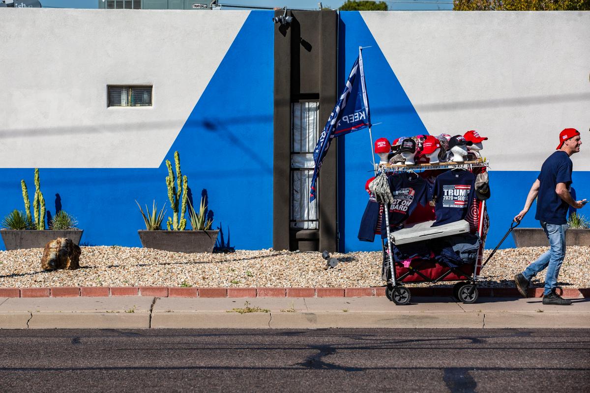  A vendor prepares to sell merchandise before a rally for President Donald Trump at the Arizona Veterans Memorial Coliseum in Phoenix, Ariz. on Feb. 19, 2020. (Caitlin O'Hara/Getty Images)
