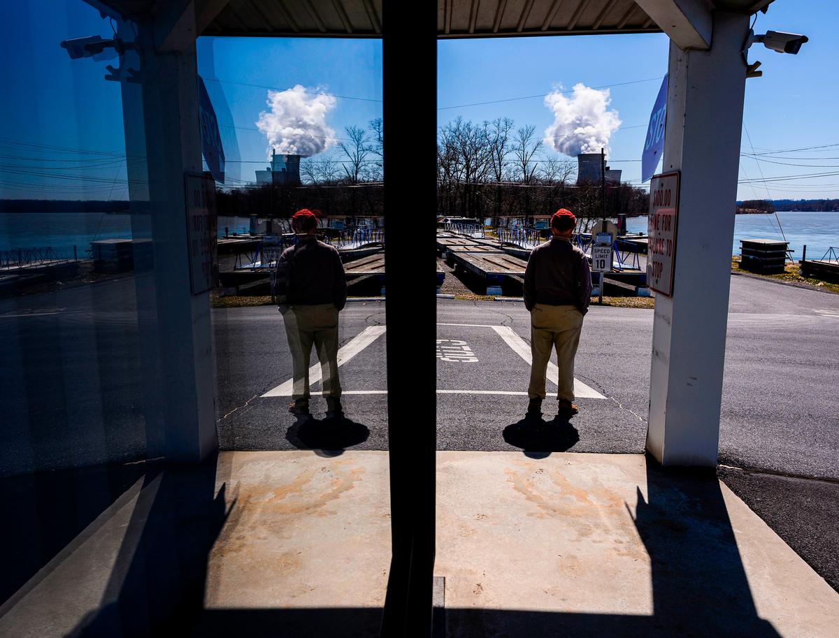 John Garver, 80, looks at the operational nuclear plant on Three Mile Island, run by Exelon Generation, from a boat house in Middletown, Pa., on March 26, 2019. (ANDREW CABALLERO-REYNOLDS/AFP via Getty Images)