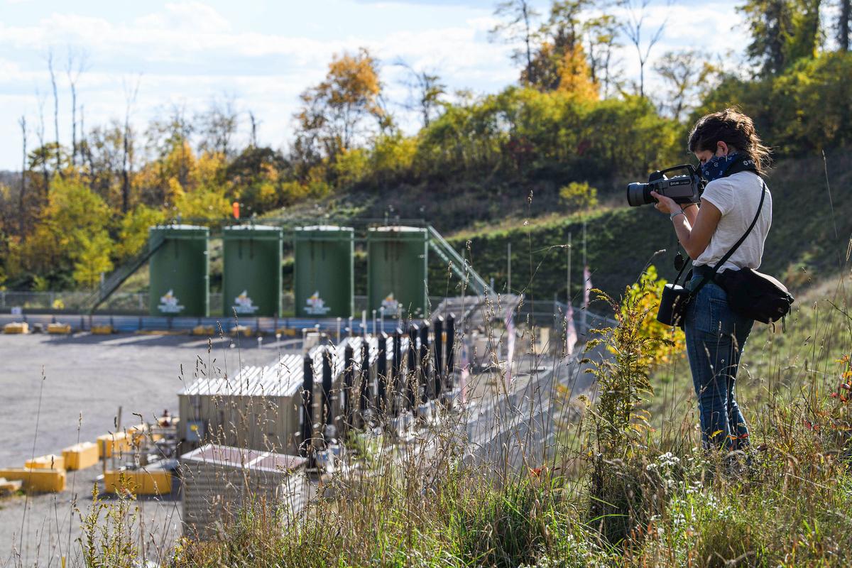Leann Leiter, an Earthworks field advocate, uses a $100,000 infrared camera to look for emissions from the Mad Dog 2020 fracking site in West Pike Run, east of Beallsville, Pa., on Oct. 22, 2020. (NICHOLAS KAMM/AFP via Getty Images)