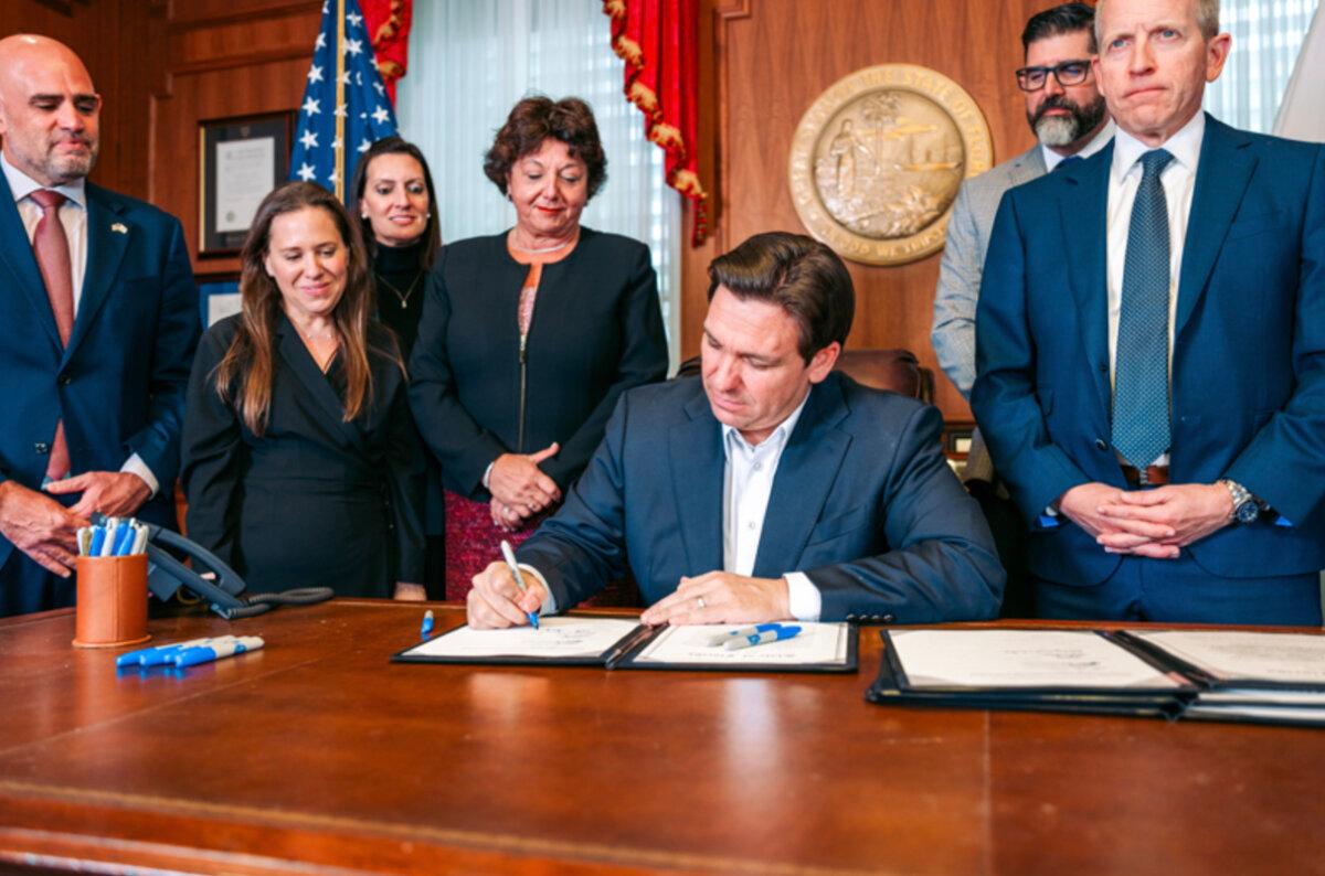Florida Gov. Ron DeSantis, a Republican, signs bills to impose sanctions on Iran, provide security funding for Jewish institutions and historically black colleges and universities, and expand Hurricane Idalia relief and school vouchers at his office in Tallahassee on Nov. 13, 2023. (Courtesy of the Florida Governor's Office)