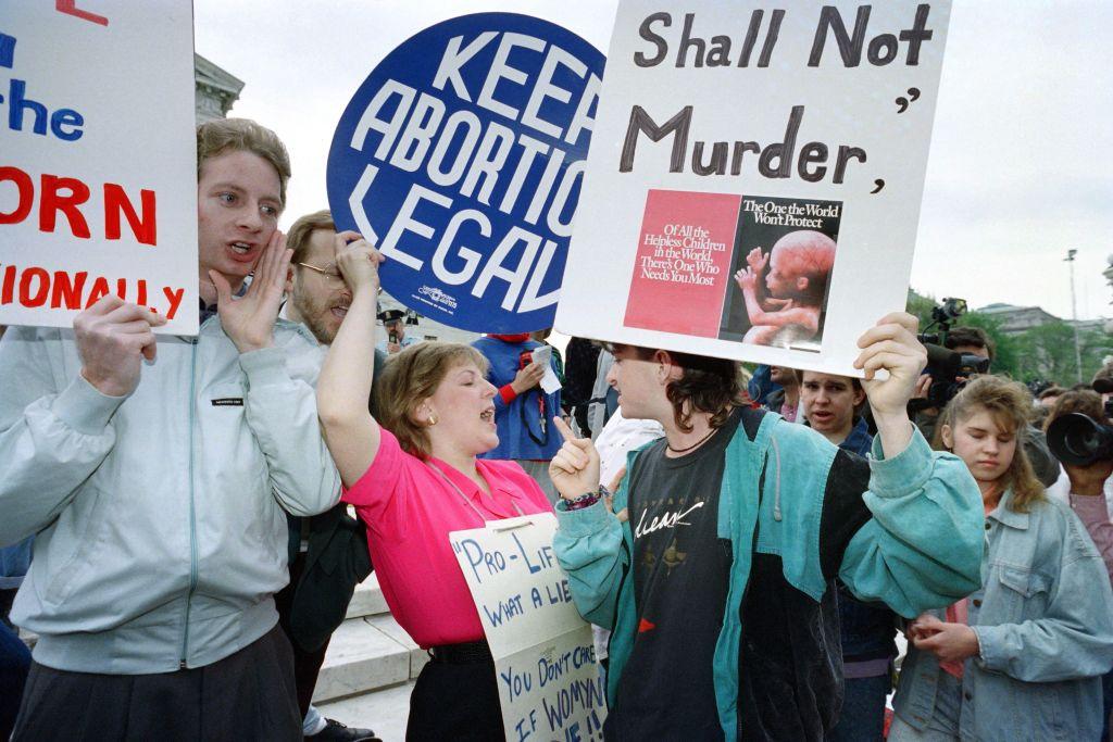Pro-choice demonstrators and anti-abortion activists meet on the steps of the Supreme Court in Washington, as the court prepares to hear arguments reopening the landmark abortion case Roe v. Wade, on April 26, 1989. (Greg Gibson/AFP via Getty Images)