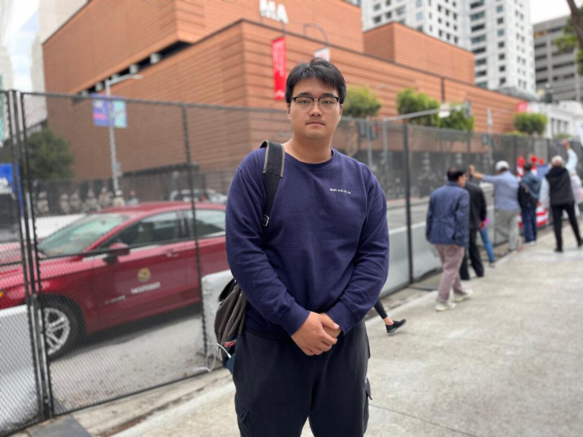  Activist Yu Dawei stands near the St. Regis hotel in San Francisco on Nov. 15, 2023. (Eva Fu/The Epoch Times)