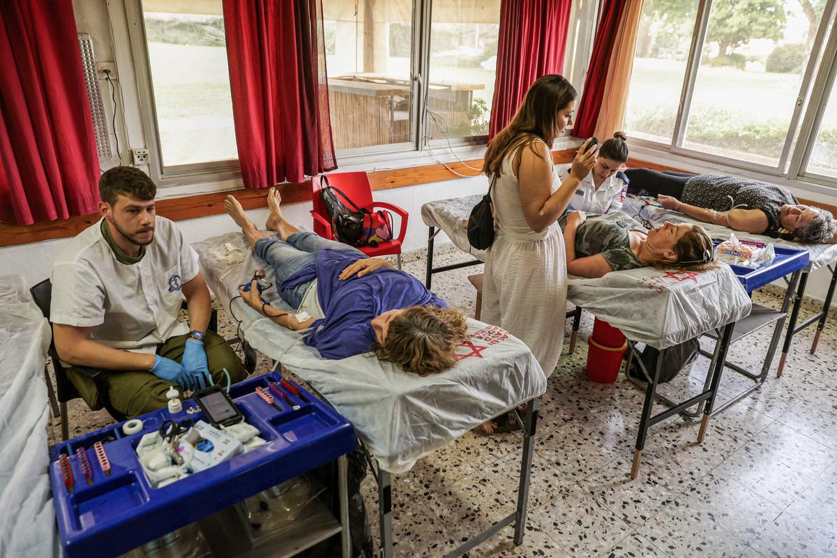 Israelis donate blood at a clinic in Kibbutz Mahanayim during a national blood drive, in northern Israel on Oct. 29, 2023. (Jalaa Marey/AFP via Getty Images)
