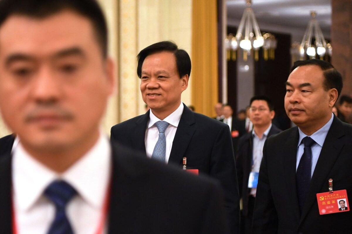 The then Chongqing Communist Party Secretary Chen Min'er (C) walks through the Great Hall of the People after attending the Chongqing province delegation meeting during the 19th Communist Party Congress in Beijing on Oct. 19, 2017. (Greg Baker/AFP via Getty Images)