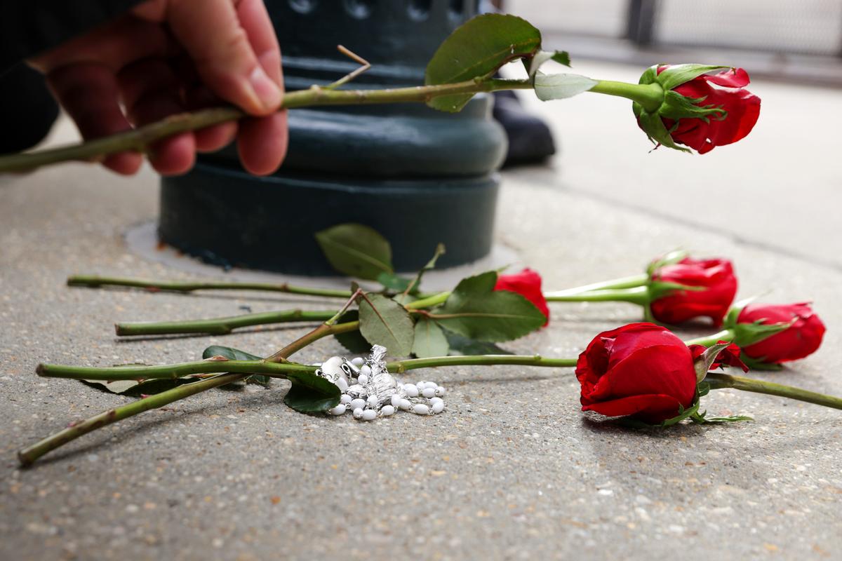 A pro-life activist places a rose on the ground outside the U.S. Supreme Court during the annual March for Life in Washington on Jan. 29, 2021. (Alex Wong/Getty Images)