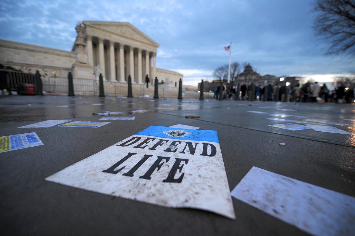 Pro-life and pro-choice supporters hold rallies into the evening outside the Supreme Court in Washington on Jan. 22, 2008. (TIM SLOAN/AFP via Getty Images)