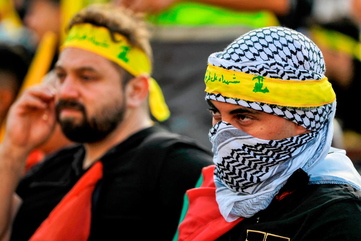  Supporters of Hezbollah watch a televised speech by its leader Hassan Nasrallah (not pictured) in Beirut, Lebanon, on Nov. 3, 2023. (PAHMAD AL-RUBAYE/AFP via Getty Images)