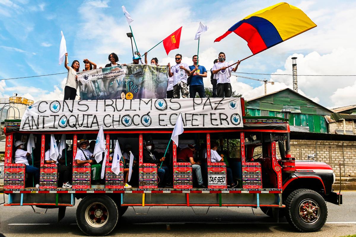 Former FARC guerrilla fighters ride in local transport vehicles toward Bogota, Columbia, to demand peace accords be respected, in Medellin, Colombia, on Oct. 29, 2020. (JOAQUIN SARMIENTO/AFP via Getty Images)