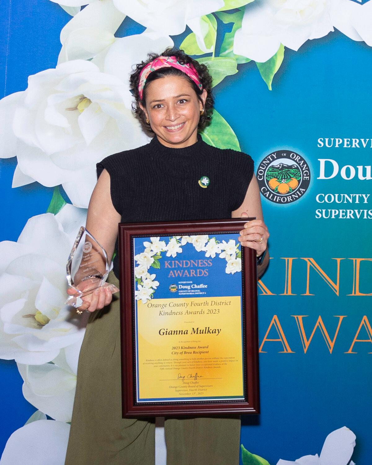 Gianna Mulkay, executive director of Foster Love, receives a Kindness Award in Buena Park, Calif., on Nov. 13, 2023. (Courtesy of Donna Edman Photography)