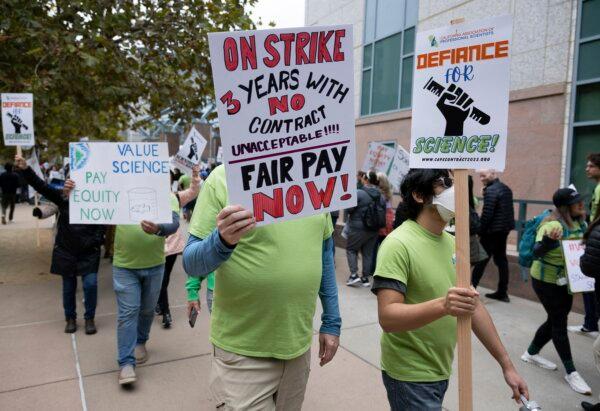 Striking members of the California Association of Professional Scientists march in Sacramento, Calif., Wednesday, Nov. 15, 2023. Thousands of scientists who work for California have begun a three-day strike over lack of progress on contract talks. (Paul Kitagaki Jr./The Sacramento Bee via AP)