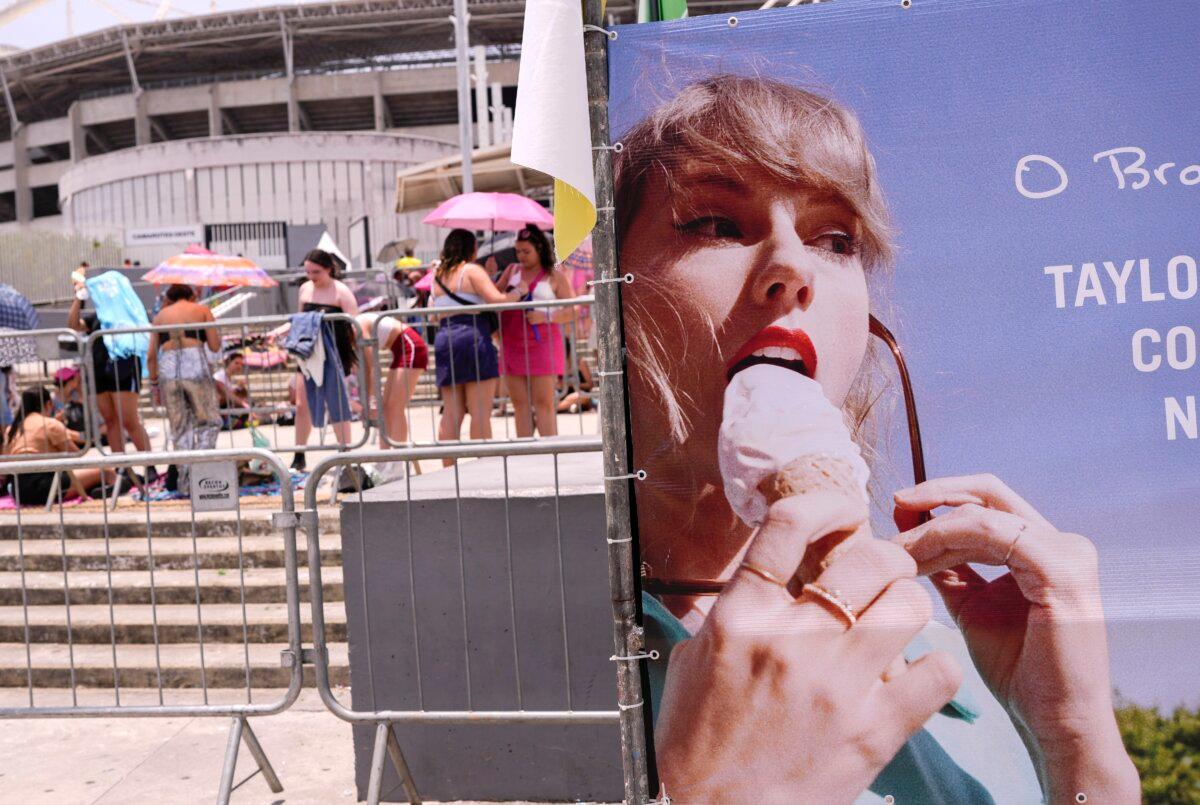 Taylor Swift fans wait for the doors of Nilton Santos Olympic stadium to open for her Eras Tour concert amid a heat wave in Rio de Janeiro, Brazil, on Nov. 18, 2023. (Silvia Izquierdo/AP Photo)