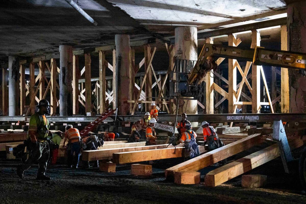 Construction crews shore up the fire-damaged 10 Freeway in Los Angeles on Nov. 16, 2023. (Sarah Reingewirtz/The Orange County Register via AP)