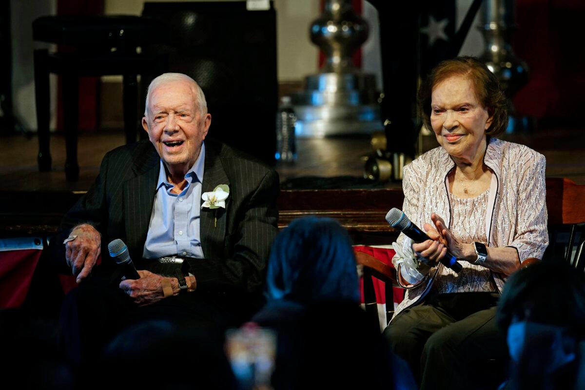 Former President Jimmy Carter and his wife, former First Lady Rosalynn Carter, sit together during a reception to celebrate their 75th wedding anniversary in Plains, Ga., on July 10, 2021. (John Bazemore/Pool via AP Photo)