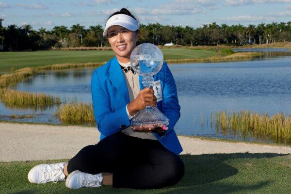 Amy Yang of South Korea poses with the trophy after winning the LPGA CME Group Tour Championship golf tournament in Naples, Fla., on Nov. 19, 2023. (Lynne Sladky/AP Photo)