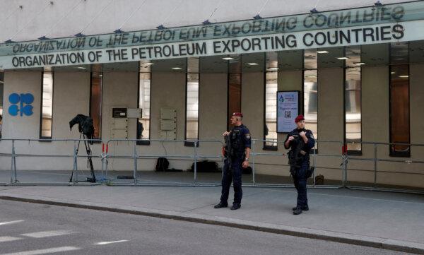Austrian police officers stand in front of the OPEC headquarters in Vienna on June 3, 2023. (Leonhard Foeger/Reuters)
