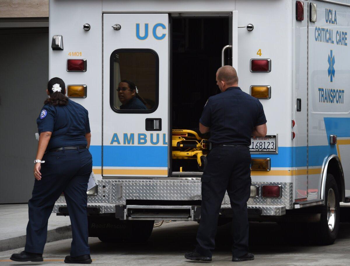 Ambulance staff at the Ronald Reagan UCLA Medical Center during their Ebola virus readiness drill to test their ability to diagnose and treat Ebola patients in Los Angeles on Oct. 17, 2014. (Mark Ralston/AFP via Getty Images)