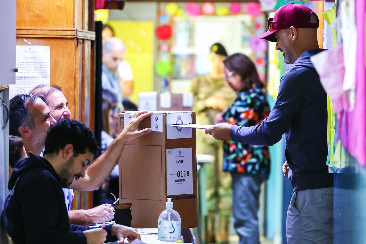A man casts his vote during the presidential election runoff between embattled economy minister Sergio Massa and libertarian outsider Javier Milei, in Buenos Aires, Argentina, on Nov. 19, 2023. (Alejandro Pagni/AFP via Getty Images)