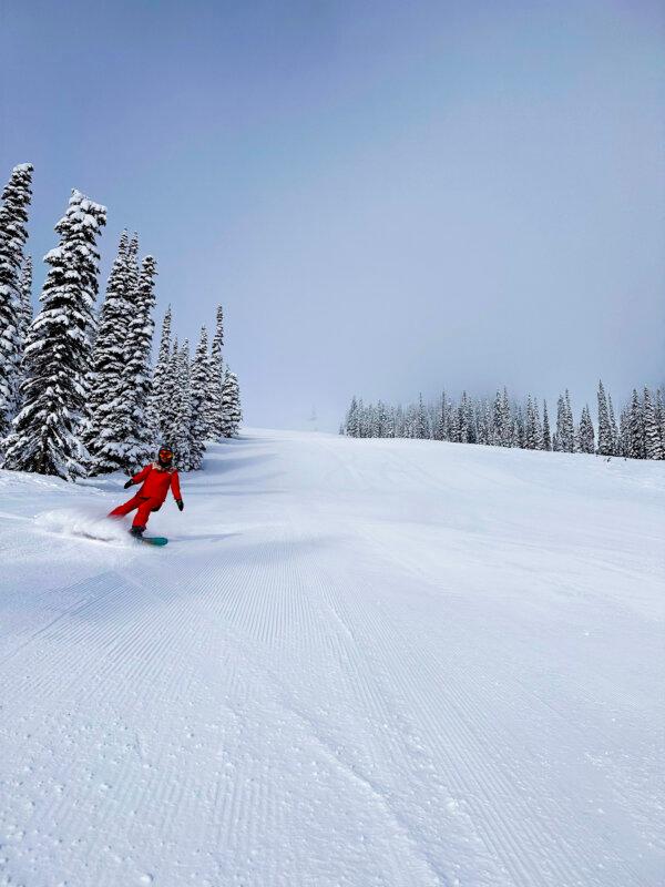 Snowboarding down a corduroy run at Schweitzer ski and snowboard resort. (Benjamin Myers/TNS)