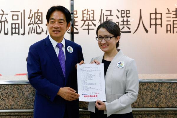 Taiwan's Vice President Lai Ching-te and running mate Hsiao Bi-Khim pose for a photo after registering for the upcoming presidential election at the Central Election Commission in Taipei, Taiwan, on Nov. 21, 2023. (Ann Wang/Reuters)