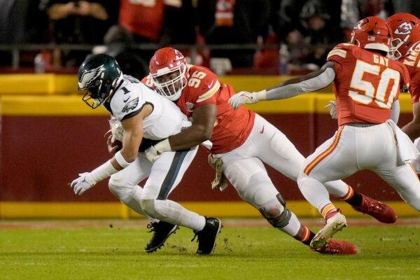 Philadelphia Eagles quarterback Jalen Hurts (1) is sacked by Kansas City Chiefs defensive tackle Chris Jones (95) during the first half of an NFL football game in Kansas City, Mo., on Nov. 20, 2023. (Charlie Riedel/AP Photo)