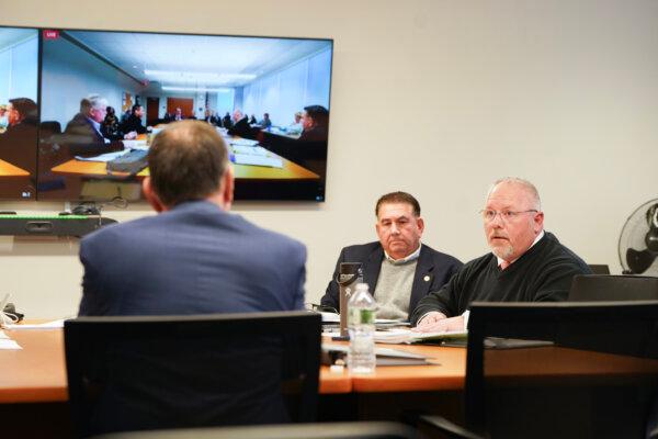 Orange County legislators Tom Faggione (R) and Robbert Sassi (C) at a special investigative committee meeting in Goshen, N.Y., on Nov. 21, 2023. (Cara Ding/The Epoch Times)