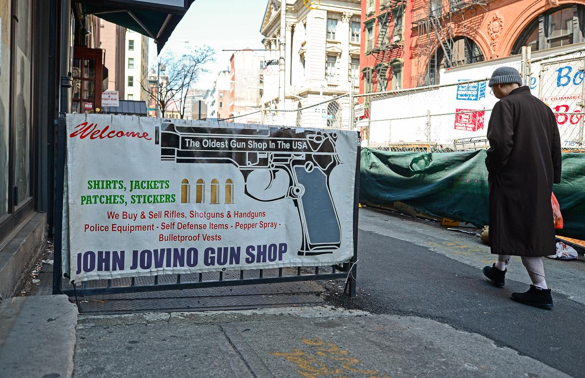 People walk past the John Jovino gunshop, which claims to be the oldest gun shop in the country, in New York City on April 8, 2013. (EMMANUEL DUNAND/AFP via Getty Images)