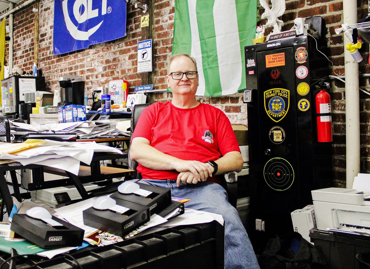 Retired New York City Police officer and New York state firearms instructor Steve Donahoo at his desk in Peekskill, New York on Nov. 8, 2023. (Michael Clements/The Epoch Times)