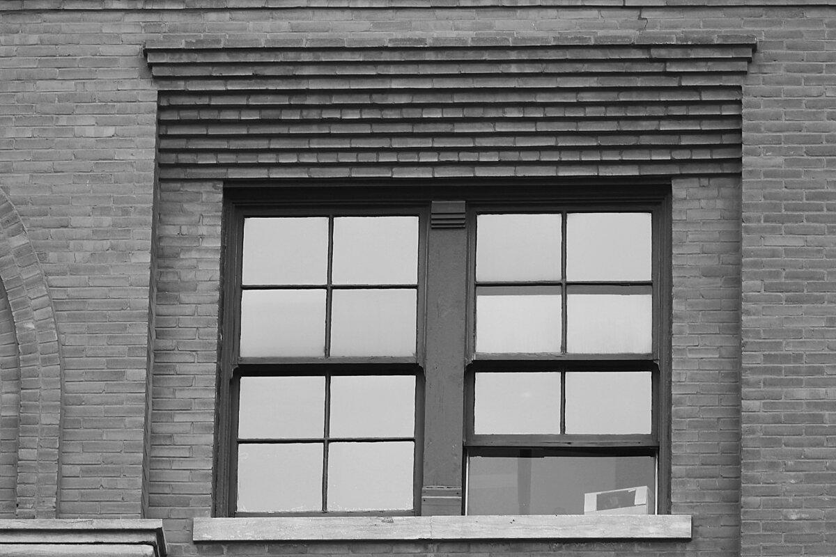 The sixth floor window of the former Texas School Book Depository, now the Dallas County Administration Building, on the 48th anniversary of JFK's assassination in Dealey Plaza in Dallas, Texas, on Nov. 22, 2011. (Ronald Martinez/Getty Images)