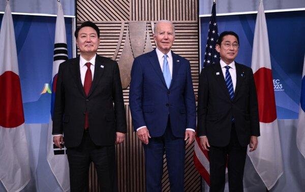 U.S. President Joe Biden, South Korean President Yoon Suk Yeol (L), and Japanese Prime Minister Fumio Kishida (R) stand for a photo during a trilateral meeting at the Asia-Pacific Economic Cooperation (APEC) Leaders' Week in San Francisco, Calif., on Nov. 16, 2023. (Brendan Smialowski / AFP via Getty Images)
