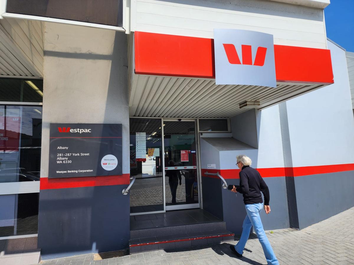 A woman walks into a regional branch of Westpac bank in Albany, Western Australia, on Nov. 22, 2023. (Susan Mortimer/The Epoch Times)