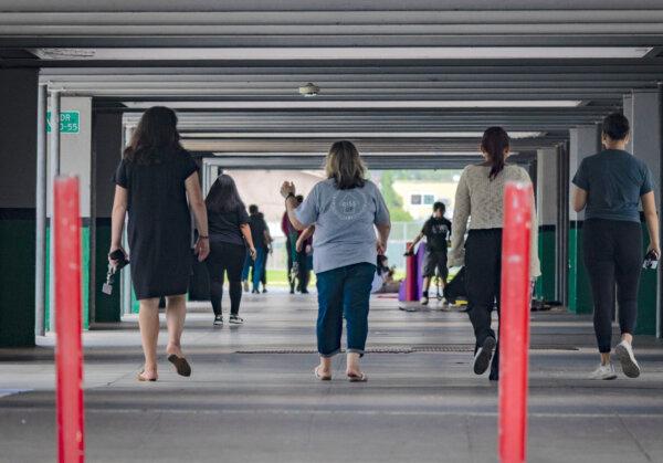 Staff and students in a hallway at a California school. California is ranked 47th in the U.S. in a national report on raising families. (John Fredricks/The Epoch Times)