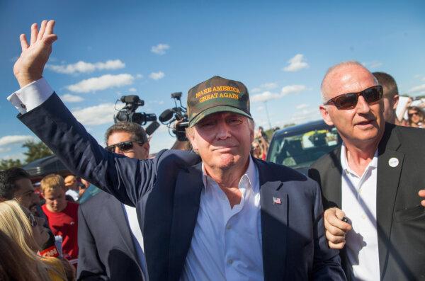 Former President Donald Trump greets fans tailgating outside Jack Trice Stadium before the start of the Iowa State University versus University of Iowa football game in Ames, IOwa, on Sept. 12, 2015. (Scott Olson/Getty Images)