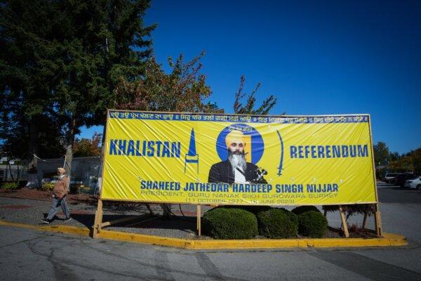 A photograph of late temple president Hardeep Singh Nijjar is seen on a banner outside the Guru Nanak Sikh Gurdwara Sahib, in Surrey, B.C., on Sept. 18, 2023. (The Canadian Press/Darryl Dyck)