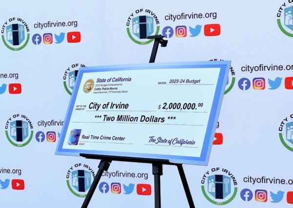 A check for $2 million is presented to the city of Irvine to establish a Real Time Crime Center in Irvine, Calif., on Nov. 21, 2023. (John Fredricks/The Epoch Times)
