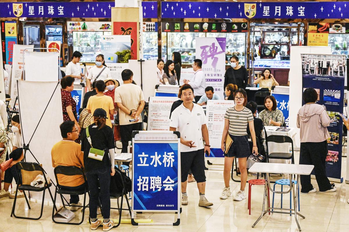 People attend a job fair in Beijing on Aug. 19, 2023. Millions of graduates are entering China's job market at a time of soaring youth unemployment. (JADE GAO/AFP via Getty Images)