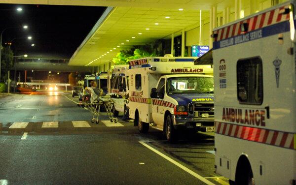 Ambulances are lined up outside Cairns Airport in Cairns, Australia, on Feb. 2, 2011. (Paul Crock/AFP via Getty Images)