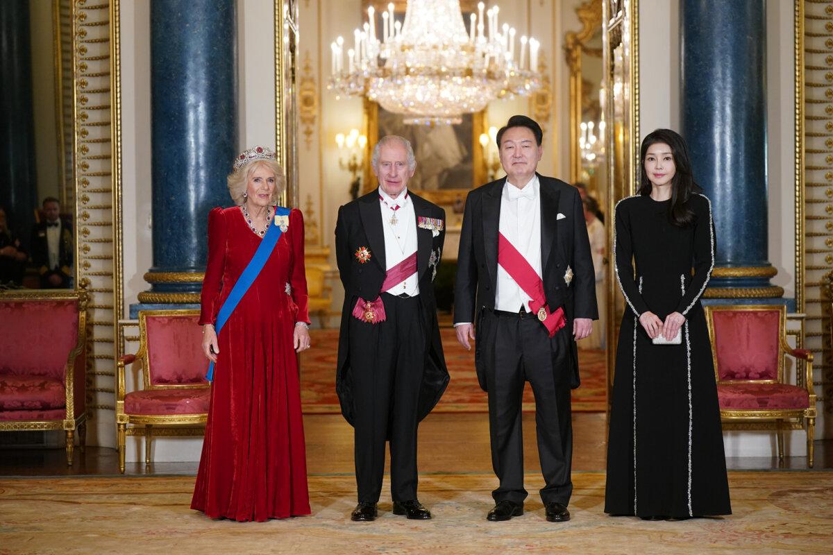 Queen Camilla, King Charles III, President of South Korea Yoon Suk Yeol, and his wife Kim Keon Hee pose together for photos ahead of the State Banquet at Buckingham Palace on Nov. 21, 2023, in London, England. (Yui Mok-WPA Pool/Getty Images)