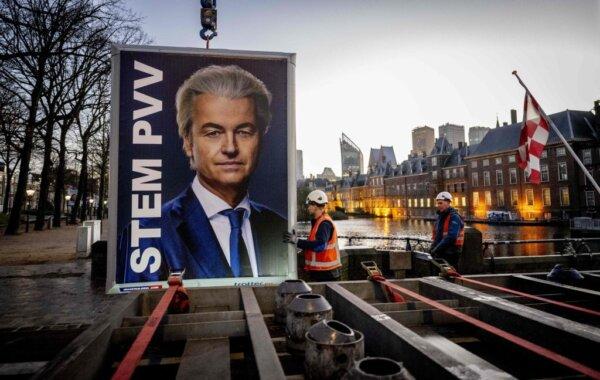 Workers prepare to remove an election sign of Party for Freedom (PVV) leader Geert Wilders near the Binnenhof, a day after the Netherlands general elections, in the Hague on Nov. 23, 2023. (Robin Utrecht/ANP/AFP via Getty Images)