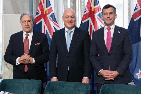 (L-R) Winston Peters, leader of New Zealand First party, New Zealand's incoming Prime Minister Christopher Luxon, and David Seymour, leader of the ACT New Zealand party, attend the signing of an agreement to form a three-party coalition government at Parliament in Wellington on Nov. 24, 2023. (Marty Melville/AFP)