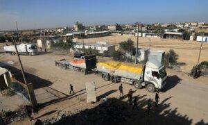 Israel Warns Gazans as Truce Begins, While Egypt Says Daily Trucks Will Carry Diesel, Aid