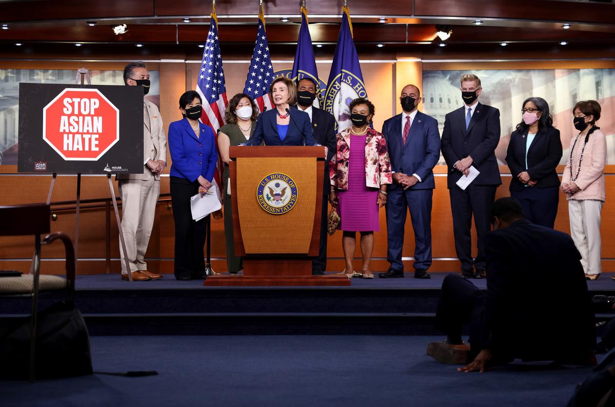  Speaker of the House Nancy Pelosi (D-Calif.), joined by members of the Asian Pacific American Caucus, speaks on the COVID-19 Hate Crimes Act at the U.S. Capitol in Washington on May 18, 2021. (Kevin Dietsch/Getty Images)