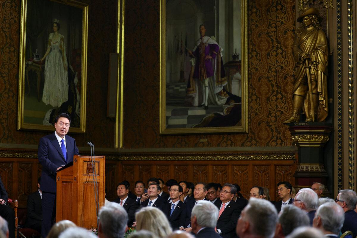 South Korea's President Yoon Suk Yeol addresses members of parliament in the Royal Gallery during a visit to the Palace of Westminster in London, England, on Nov. 21, 2023. (Hannah McKay/WPA Pool/Getty Images)