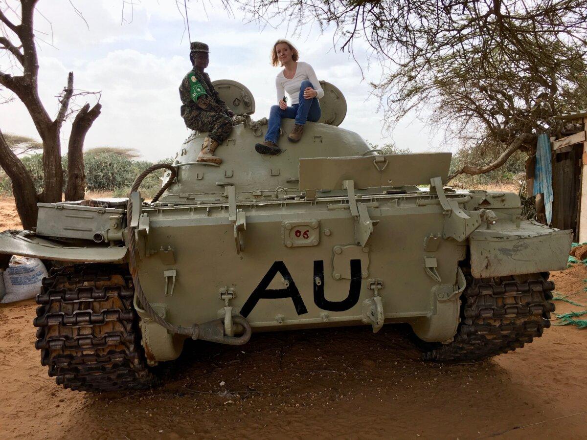 Ms. Ferguson reports from atop an African Union tank. (Courtesy of Jane Ferguson）